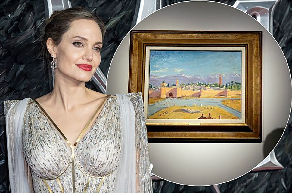 Angelina Jolie in front of the picture of Winston Churchill