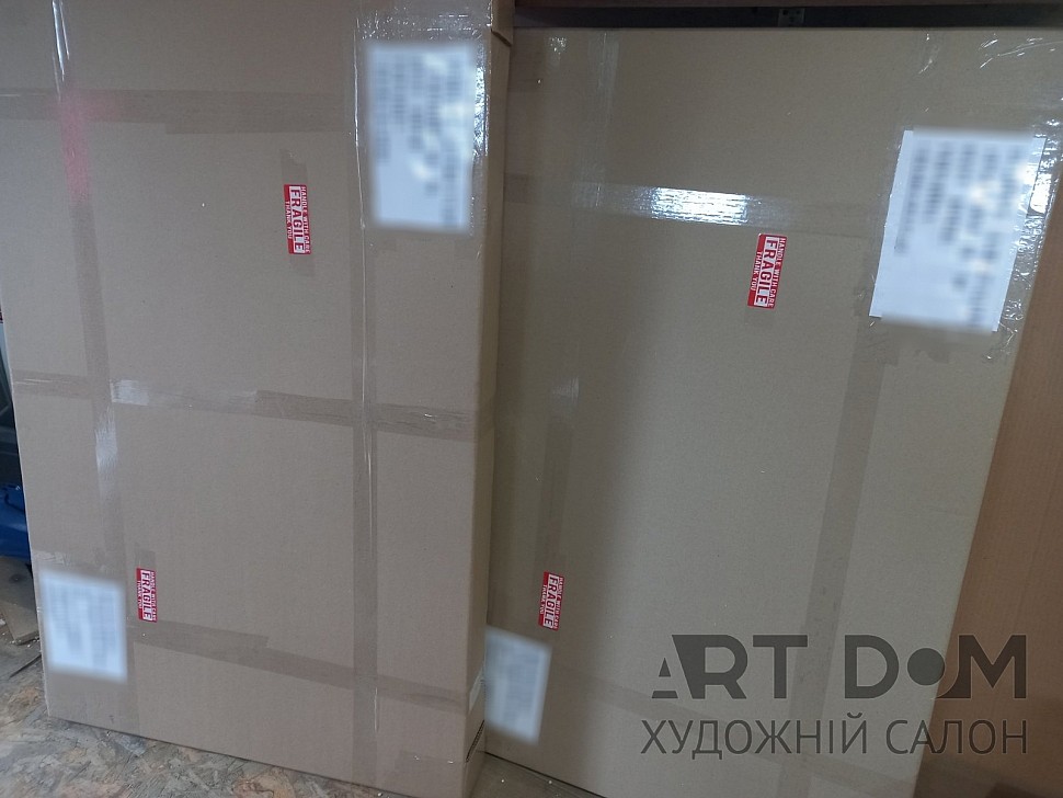 Paintings in a cardboard box, shipped by mail, post