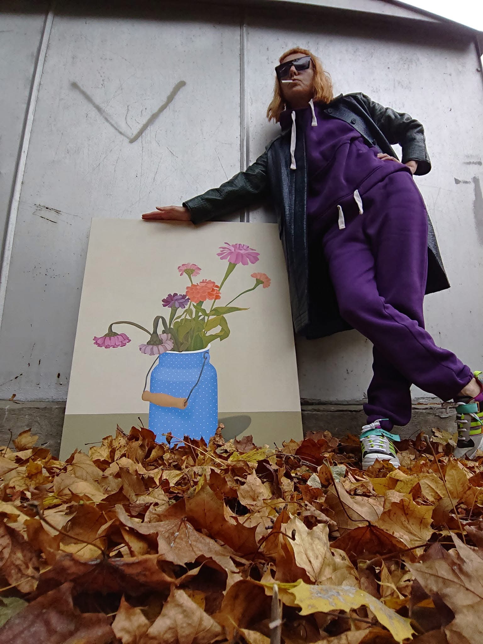 artist Lera Fokina next to her painting